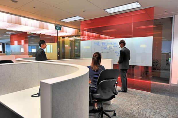 Photo of writeable glass near entrance to office floor ABW